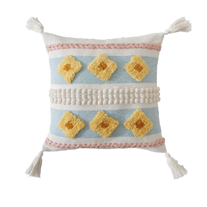 Structured decorative pillow with tufted diamonds, relief border, and corner tassels