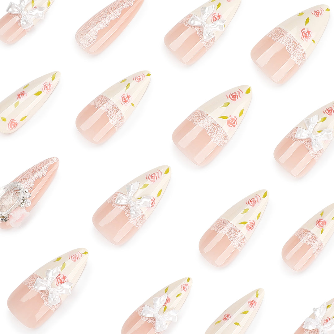 Artful stiletto nails with floral accents and glitter accents Kalsten
