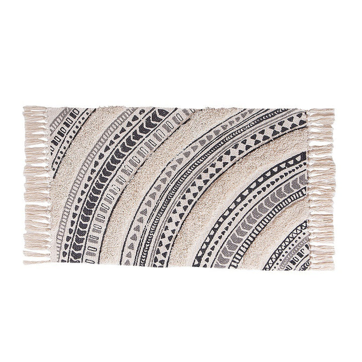 Flat Boho runner rug made of cotton blend fabric with geometric hexagon tufting and decorative fringed edge.