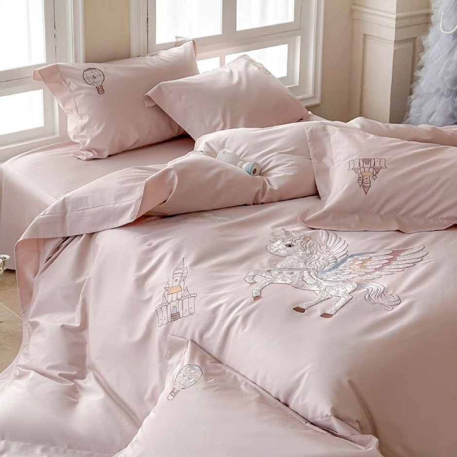 Luxurious satin bedding set with embroidered unicorn motif and fairy tale castle application