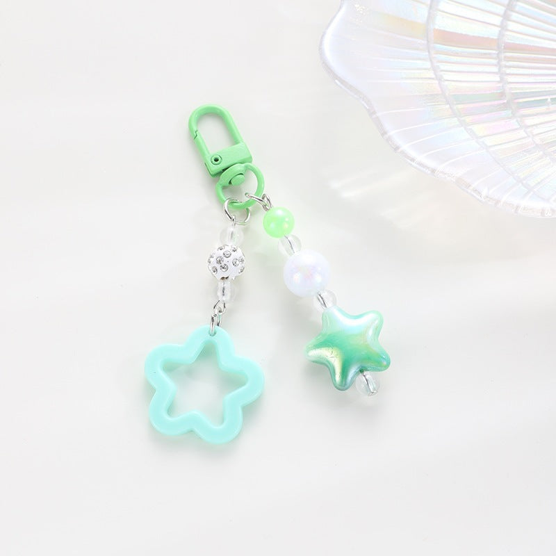 Playful keychain with floral and star motif Kalsten