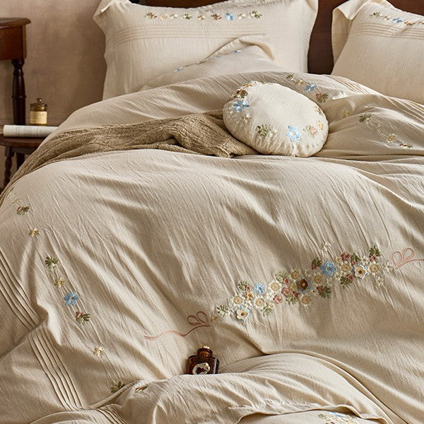 Soft cotton gauze bed set with hand-stitched flowers and decorative ruffle