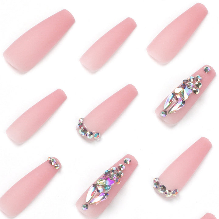 Artistic acrylic nails with glitter and rhinestone embellishments Kalsten
