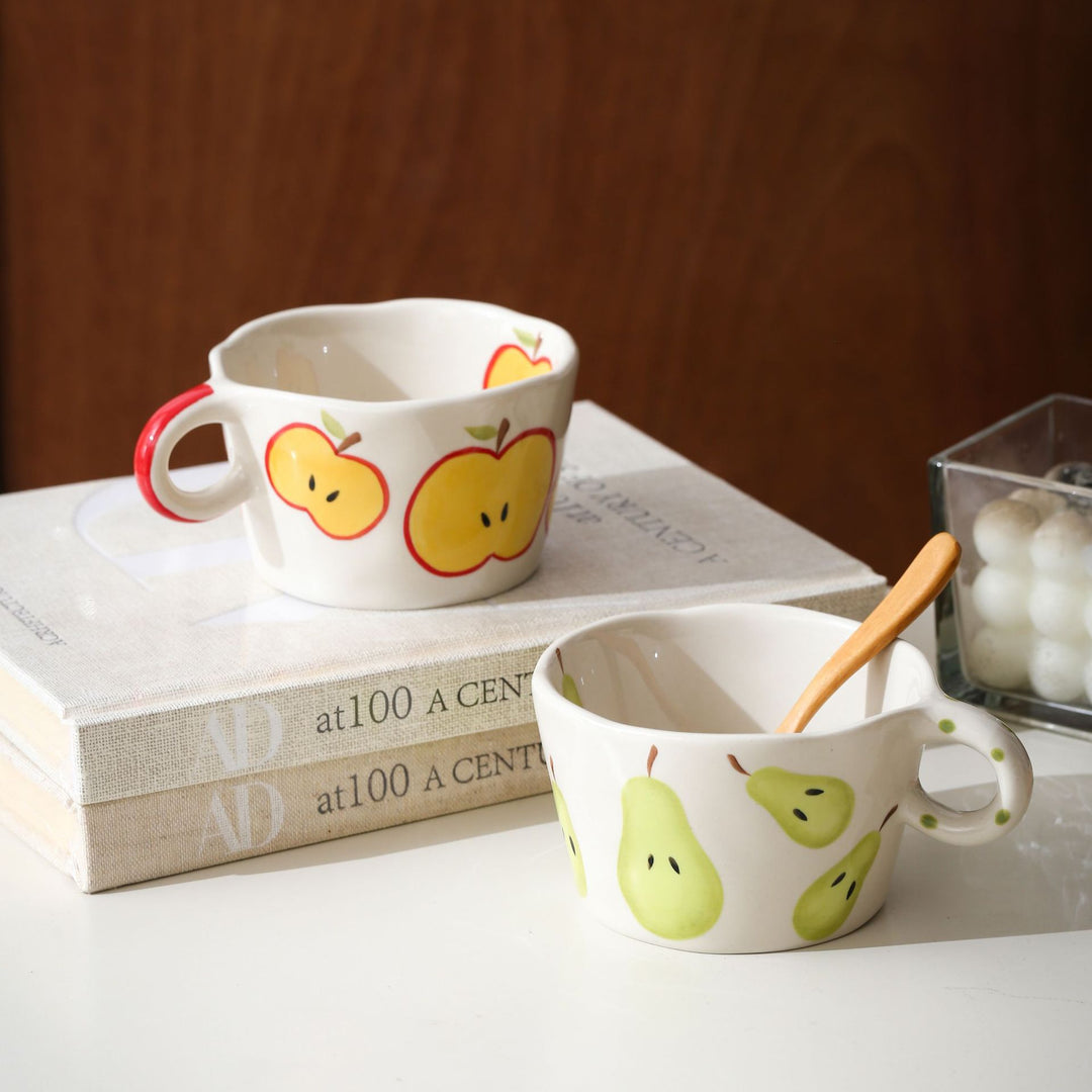 Ceramic mug with hand-painted banana illustration and round handle