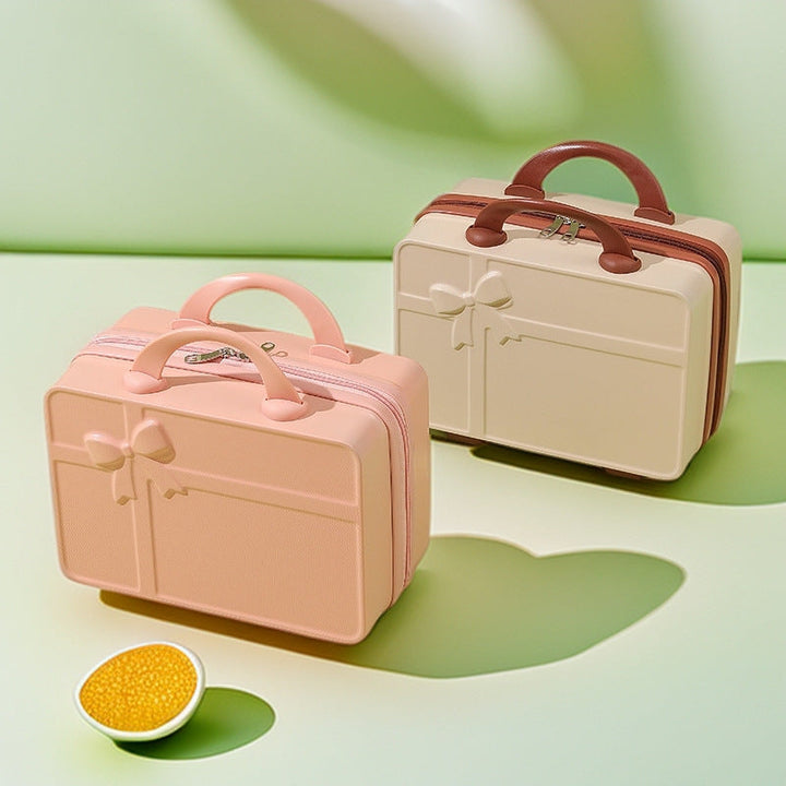 structured hard-shell cosmetic travel case with embossed bow and dual top handles Kalsten