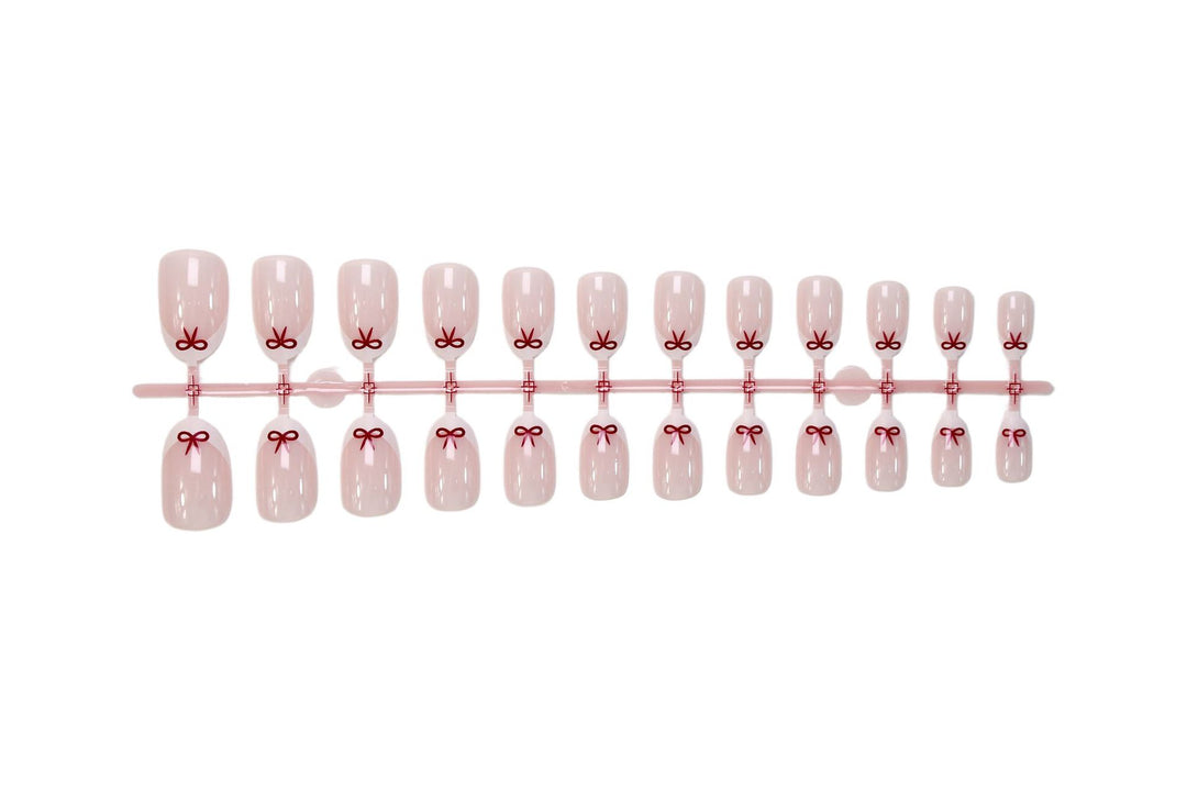 Artificial nail set with romantic bow motifs and French design Kalsten
