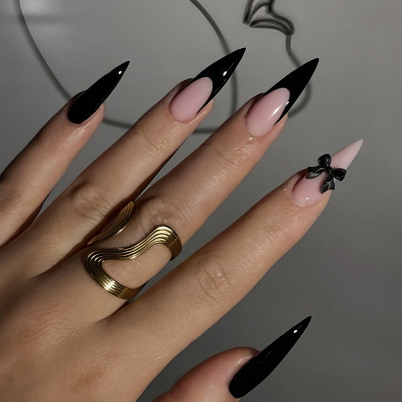 Acrylic nail set with elegant black-and-white design and playful accents Kalsten