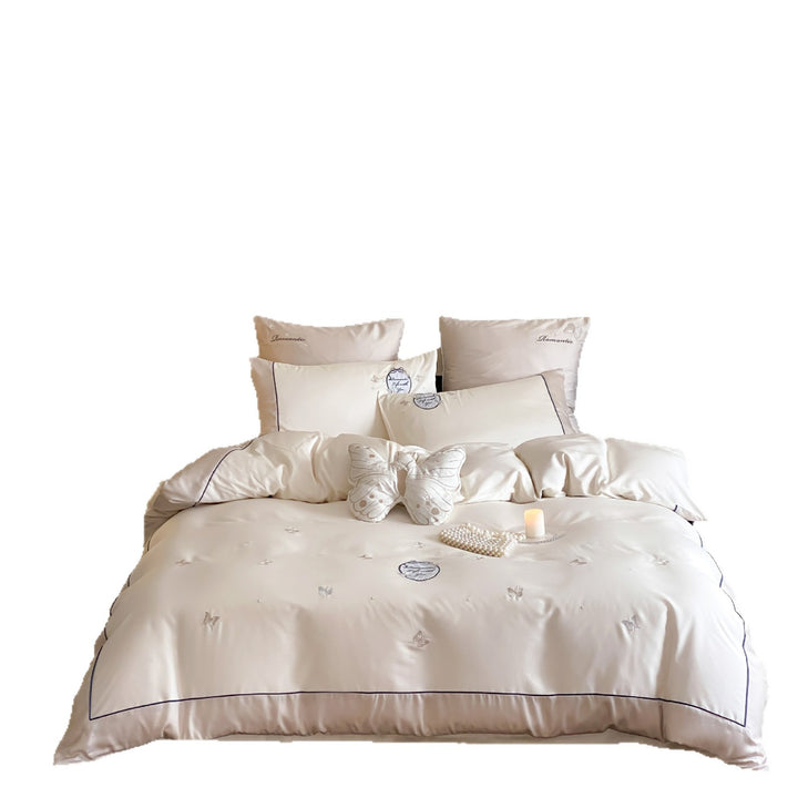 Luxurious cotton satin bedding set with embroidered butterfly appliqués and fine piping