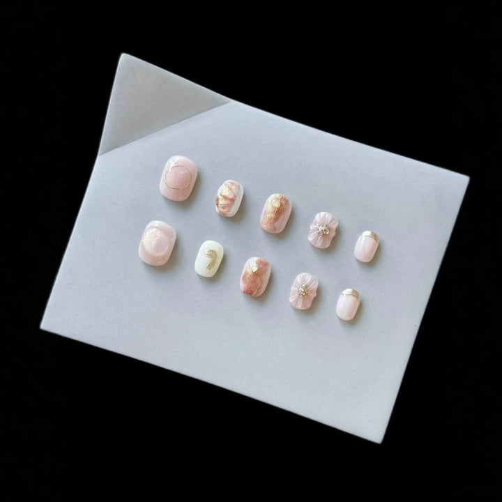 Artistic Press-On Nail Set with Decorative Floral Accents