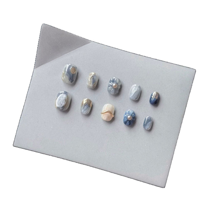 Artistic Press-On Nail Art Set with Unique Floral and Marble Accents