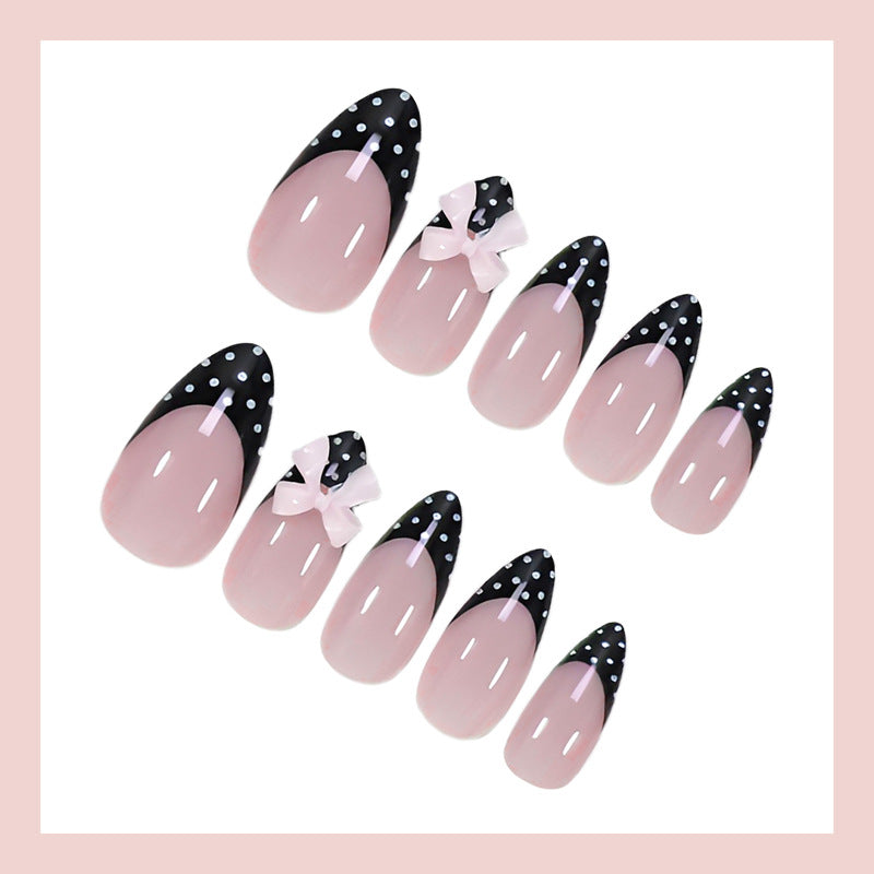 Artificial nail set with glamorous black and white polka dot accents Kalsten