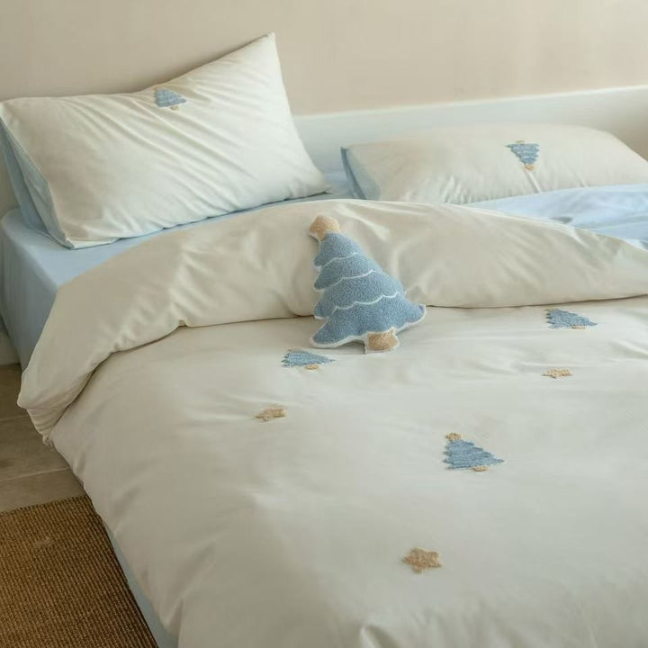 Children's bedding set with embroidered penguin appliqués and plush cuddle details