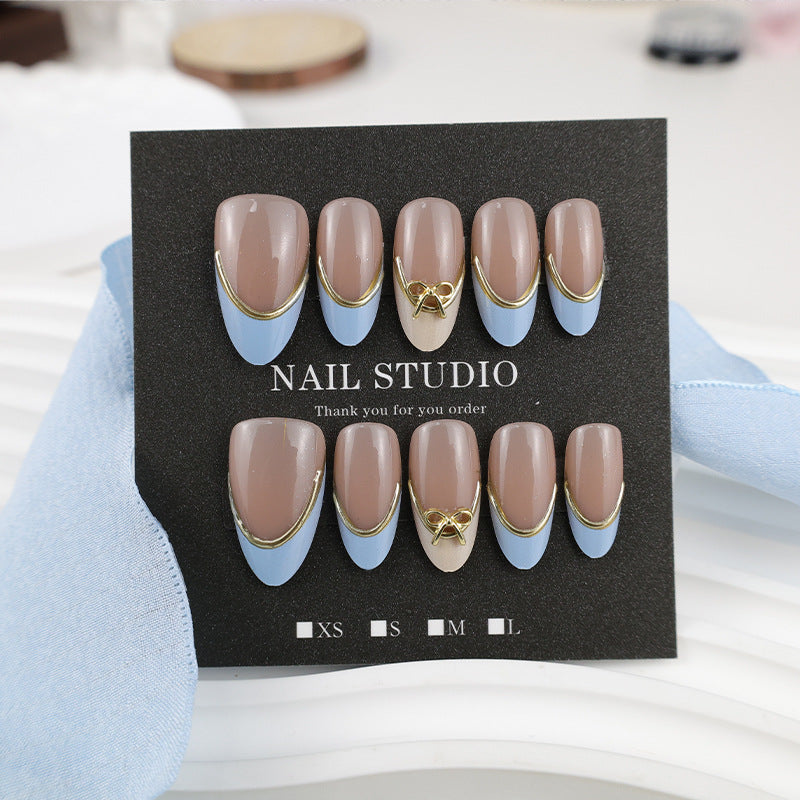 Acrylic nail set with elegant designs and gold accents Kalsten