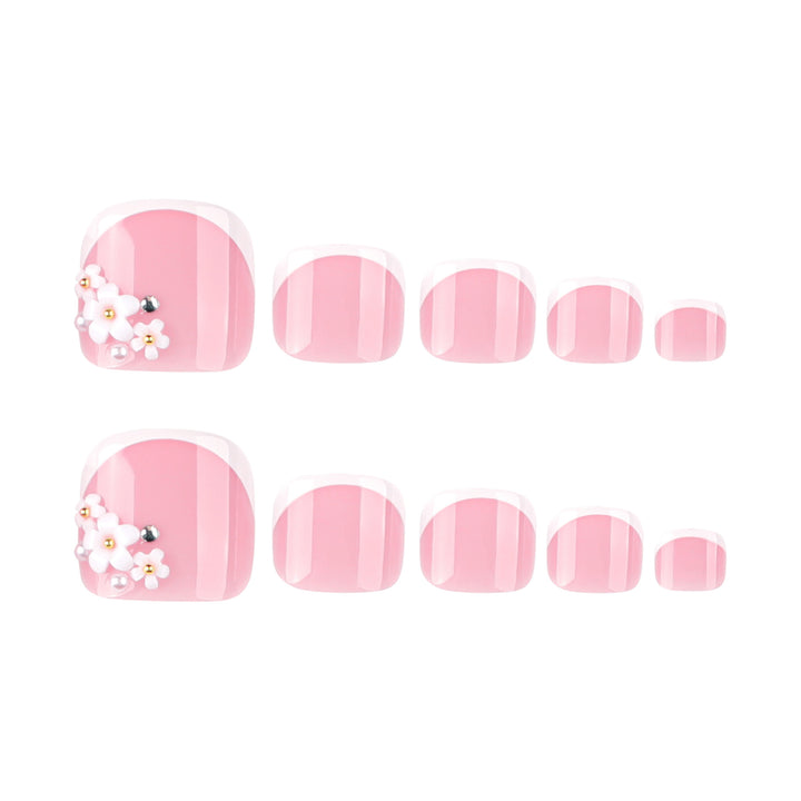 Artful toenail design with delicate flower and French tip accents Kalsten