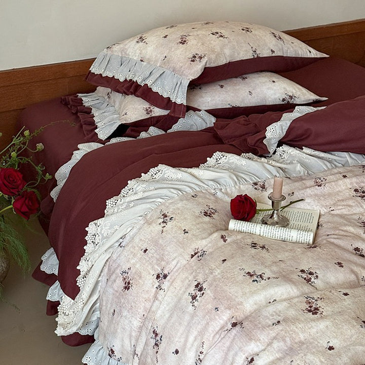 Romantic bed linen set with lace trim, ruffles, and fine floral print