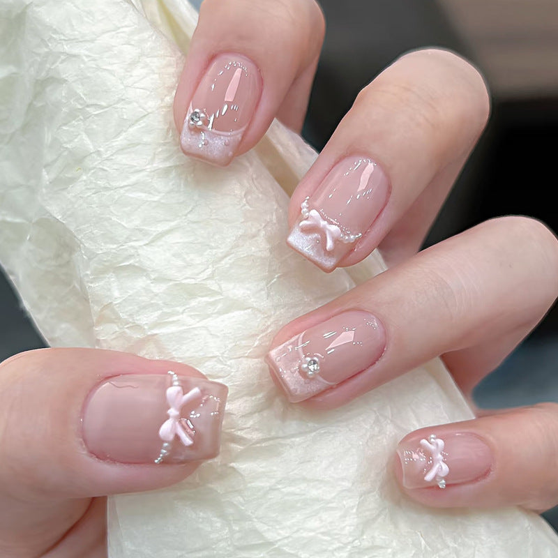 Decorative Press-On Nail Art with Bow and Gem Accents Kalsten