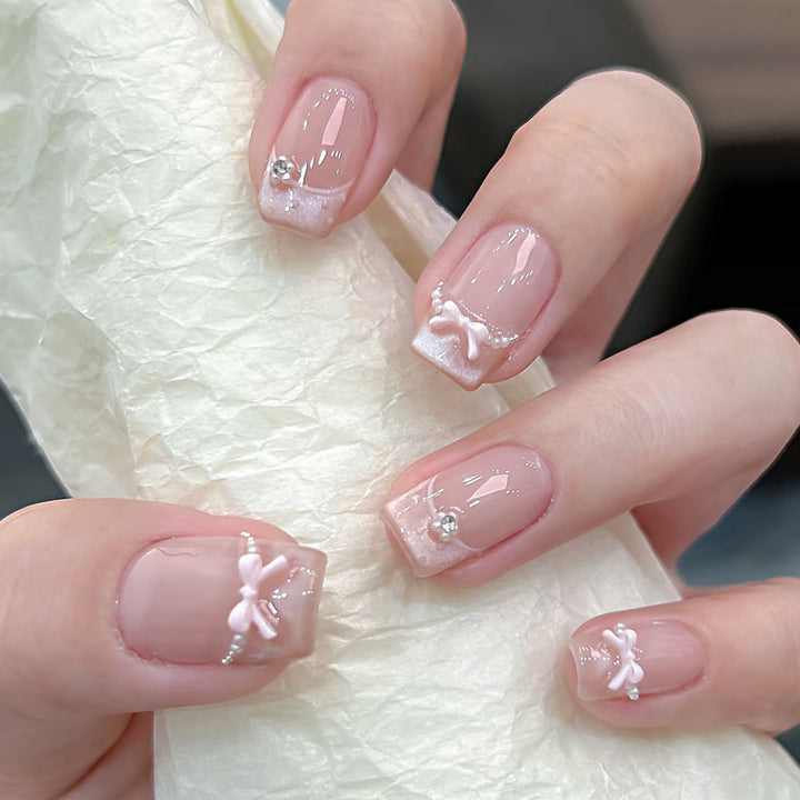Decorative Press-On Nail Art with Bow and Gem Accents Kalsten