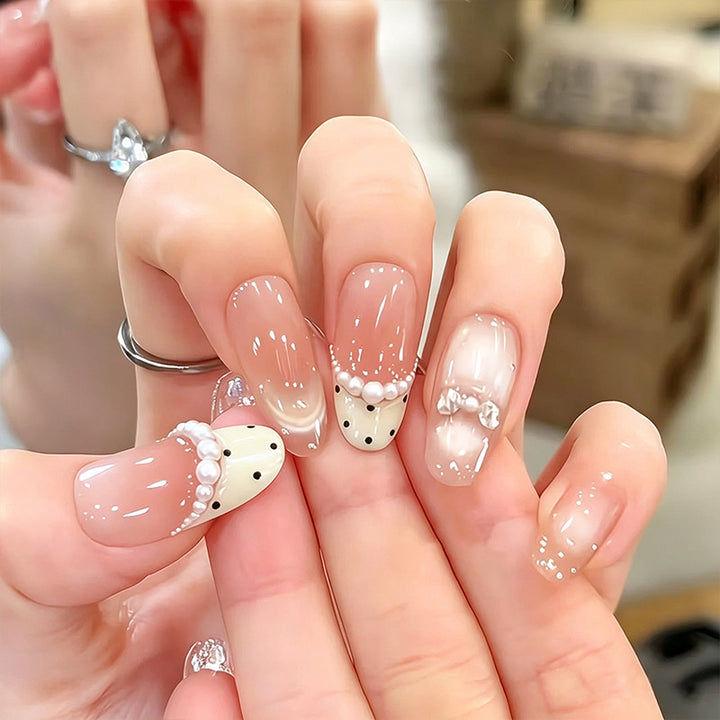 Artificial nail set with elegant French design and delicate pearl embellishments Kalsten