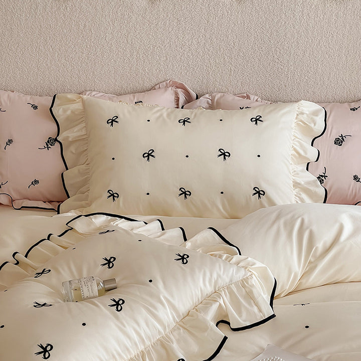 Exclusive bedding set in romantic style with ruffle, subtle bow embroidery, and breathable cotton satin
