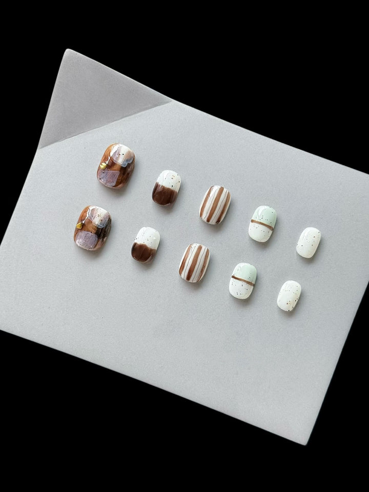 Artistic Press-On Nail Set with Geometric Patterns and Glossy Finish