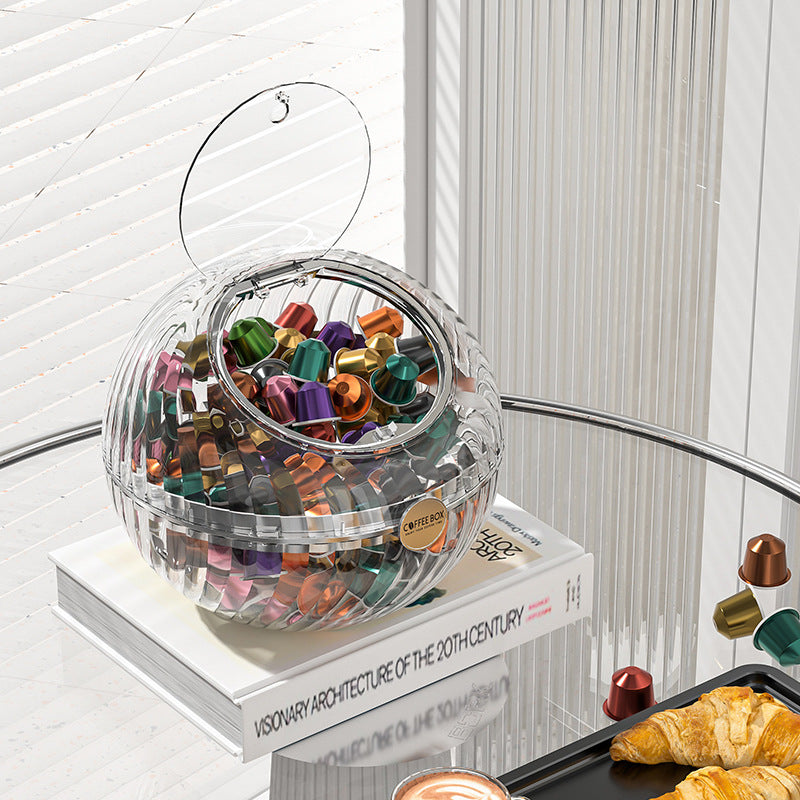 Spherical coffee capsule dispenser made of clear acrylic with flip lid