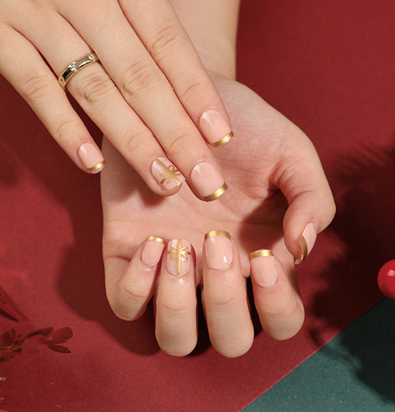 Elegant artificial nails with golden accents and floral design Kalsten