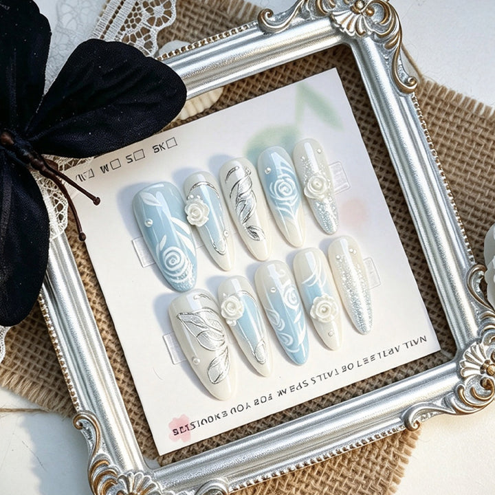 Artificial nail set with elegant floral motifs and glitter effects Kalsten