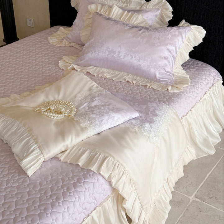 Luxurious satin bedding set with ruffles, jacquard pattern and lace trim