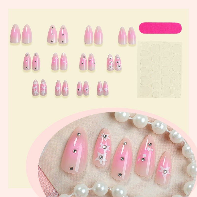 Artificial nail set with sparkling rhinestone accents and playful star motifs Kalsten