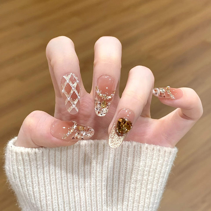 Glamorous artificial nails with glitter and heart design Kalsten