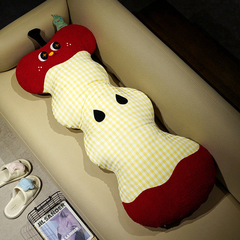 Extra-long ergonomic cuddle body pillow in apple core design with gingham cover and soft plush ends