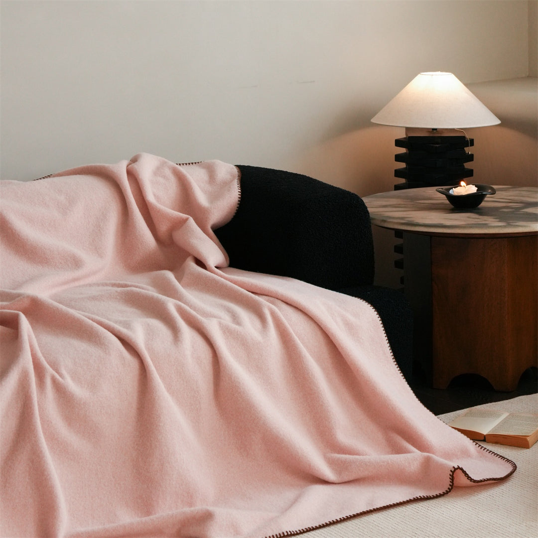 Premium wool blanket with fine hand-stitched edge and particularly soft drape