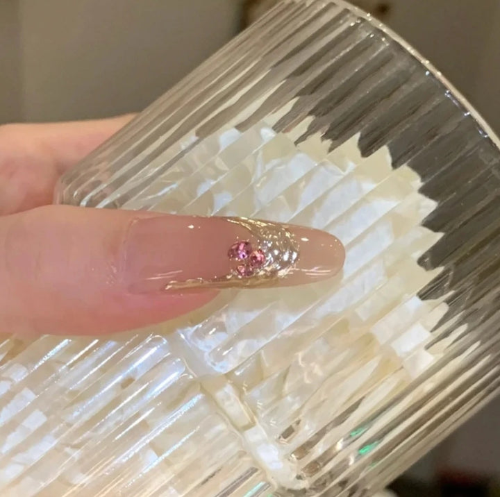 Decorative Acrylic Nail Extensions with Floral Accents