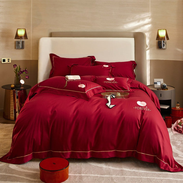 Premium cotton satin bedding set with gold piping and heart embroidery