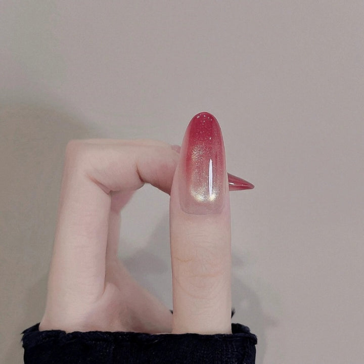 Glossy Ombre Nail Extensions with Gold Accents