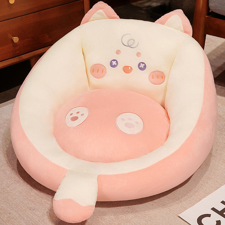 Plush pet bed with raised edge and removable cuddly pillow