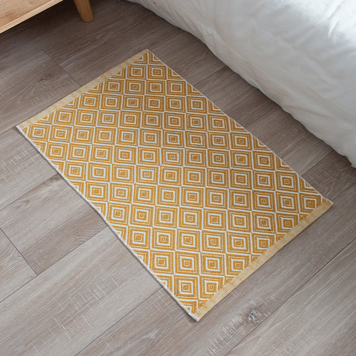 Striped cotton doormat with non-slip bottom and decorative woven edge Kalsten