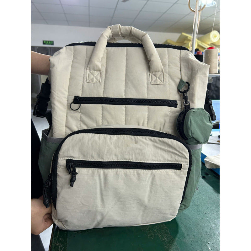 Multifunctional backpack with padded carrying handles and multiple compartments Kalsten