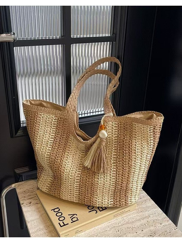 Braided beach bag with decorative tassel pendant Kalsten