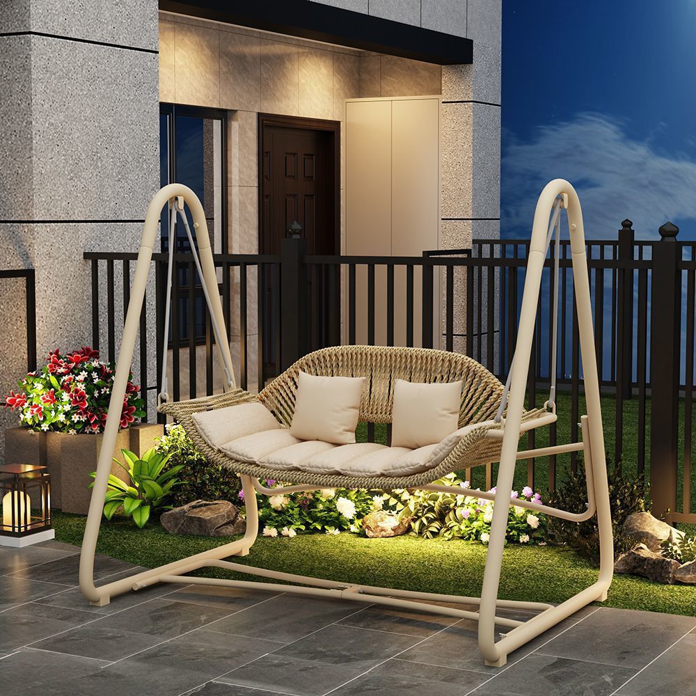 Woven rattan outdoor swing loveseat with padded cushions and powder-coated steel frame Kalsten