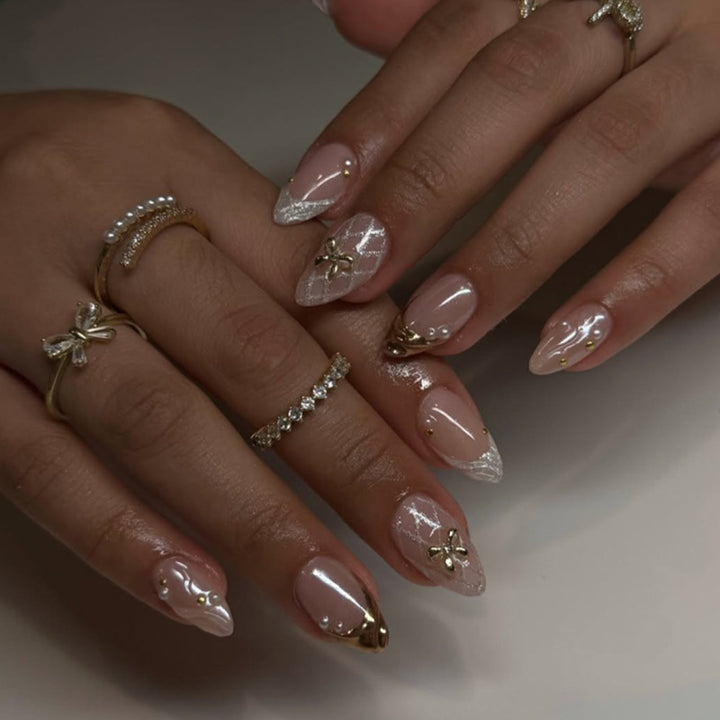 Artful stiletto nails with glitter and flower accents Kalsten