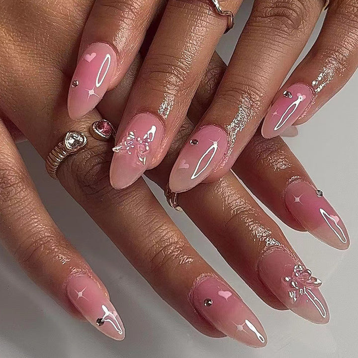 Artful nail art with heart motifs and glitter accents Kalsten