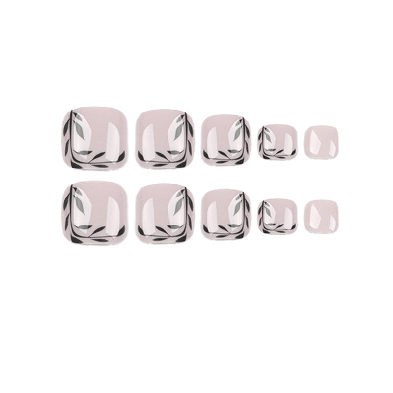 Artful toenail art with delicate leaf motifs Kalsten
