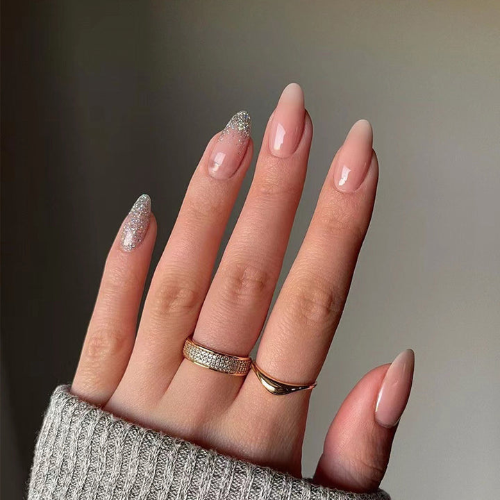 Artful nail art with rhinestone embellishments and elegant gradient color Kalsten