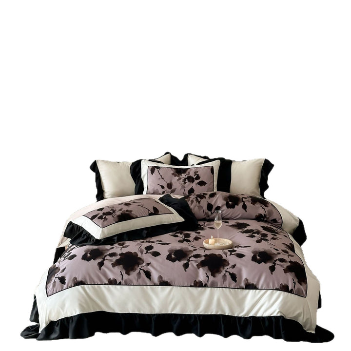 Satin bedding set with watercolored floral print, contrasting piping and flowing ruffles