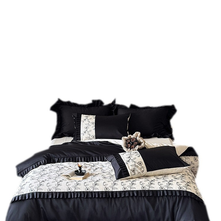 Elegant reversible bedding set made of fine satin with botanical contour print and pleated border
