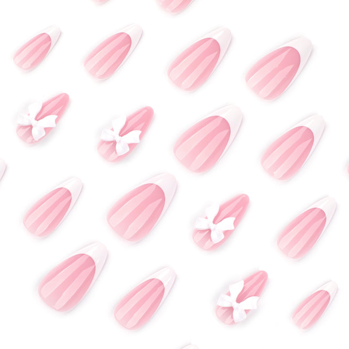 Artful nail designs with elegant tips and delicate bow motifs Kalsten