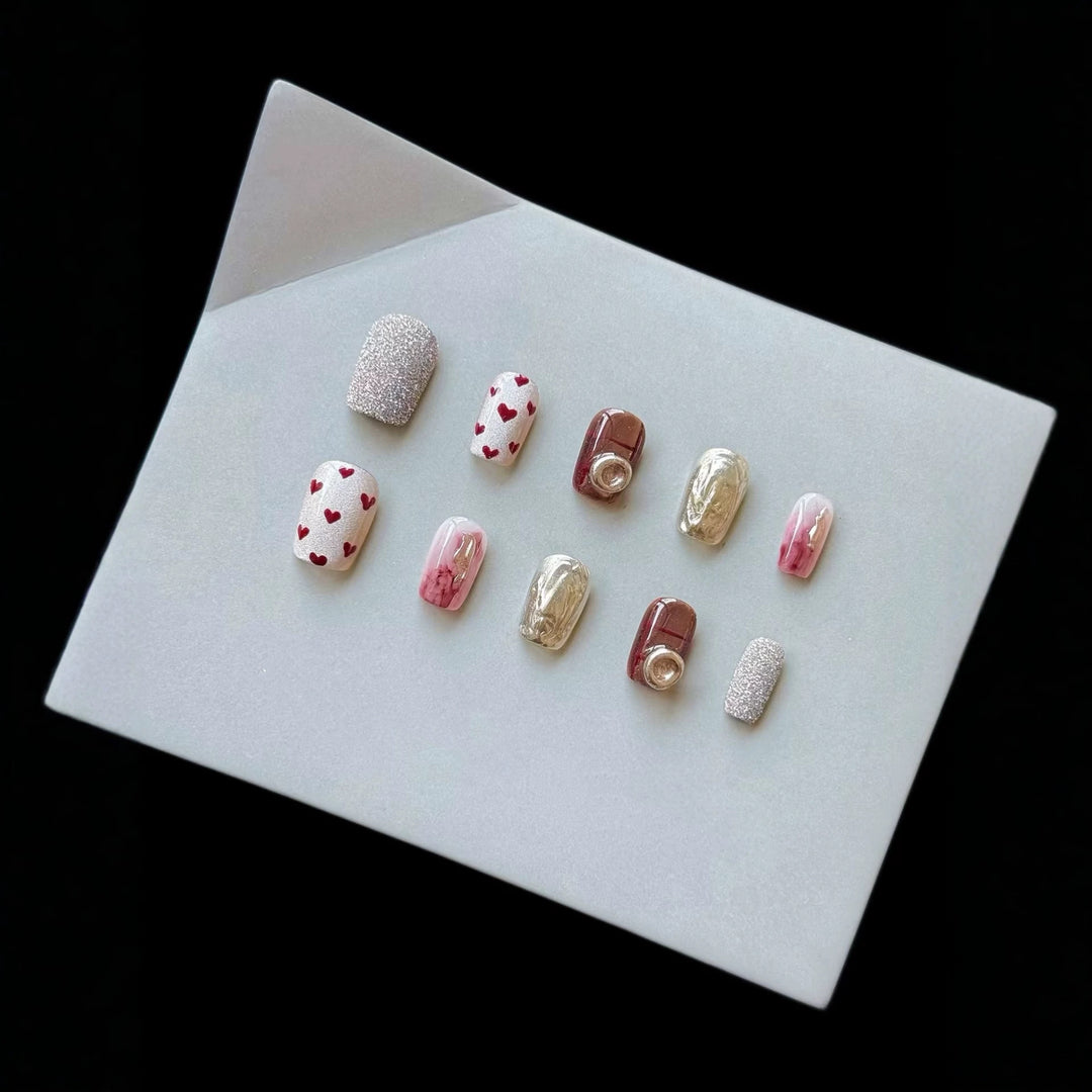 Artistic Press-On Nail Set with Heart and Glitter Accents