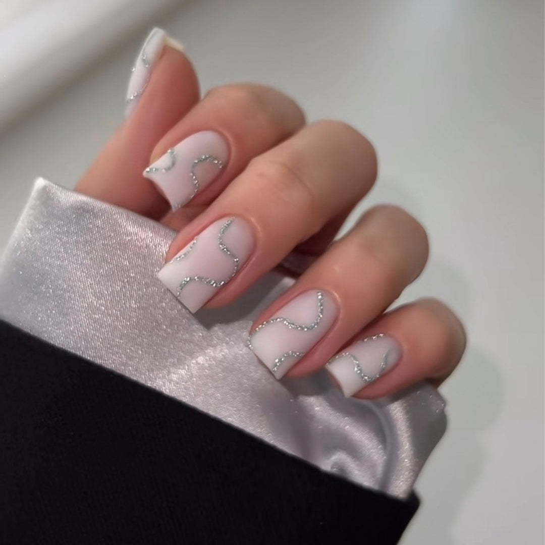 Artificial nail set with elegant lines and glitter accents Kalsten