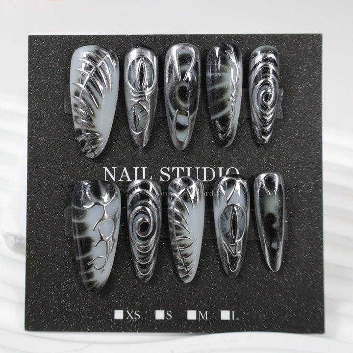 Artificial nail set with modern spiral pattern and shiny accents Kalsten